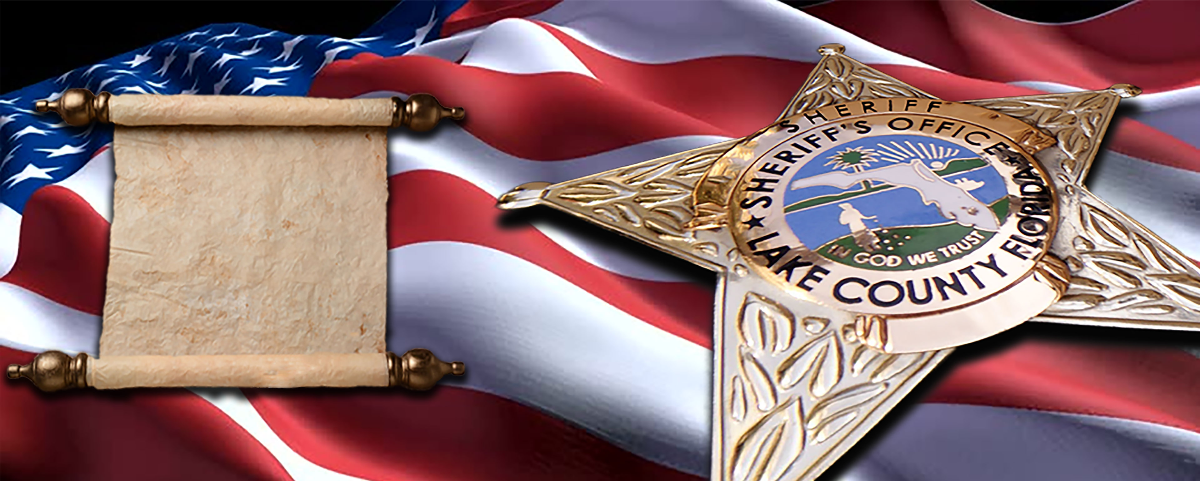 Ruffled American flag with Oath of office scroll and close up of Sheriff badge in foreground